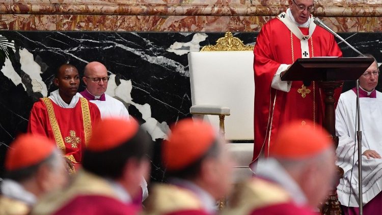 Cardinals listen to Pope Francis at a Mass in St. Peter's Basilica