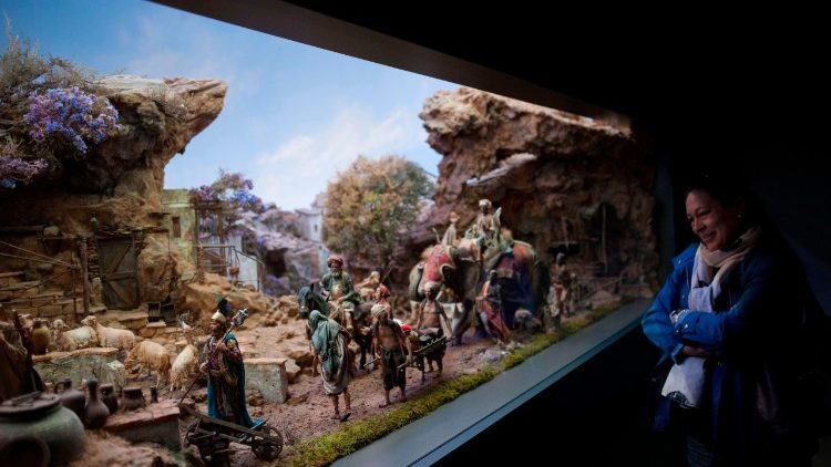 Woman looking at a Nativity Scene in the world's largest musuem of nativity scenes in Spain.