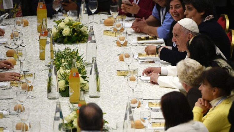 Pope Francis shares a meal with homeless people on the World Day of the Poor