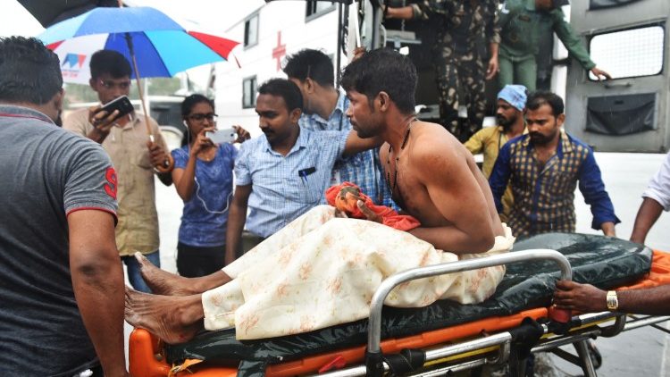 A stranded fisherman rescued by Indian naval and air force from Okhi arrives at Thiruvananthapuram