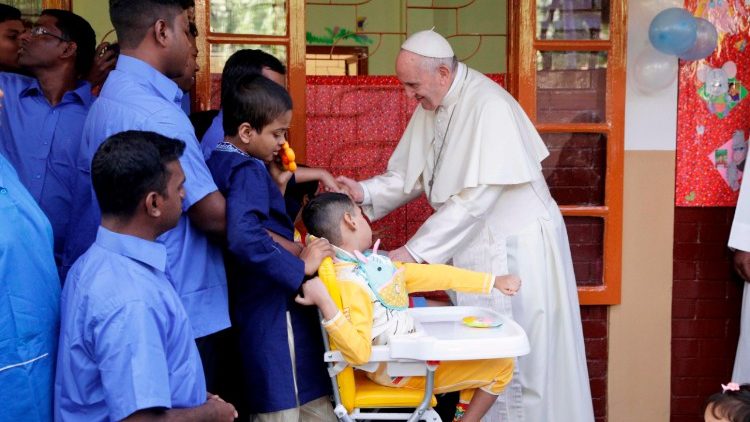 Pope blessing a sick child and his assistants in Bangladesh in December, 2017.