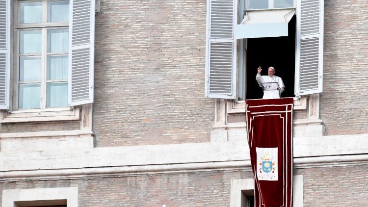 Pope Francis greets the crowds in St. Peter's Square for the Sunday Angelus