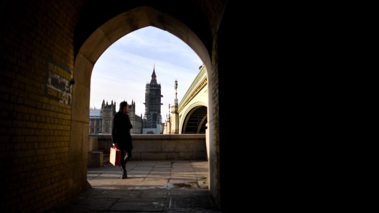 A view of the Houses of Parliament under Westminster Bridge in London