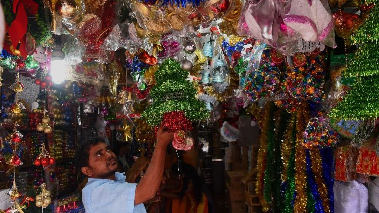 Sri Lankan vendor arranges Christmas decorations for sale
