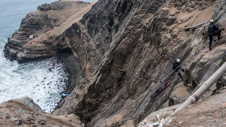 Rescuers work at the site of a coach crash in Peru