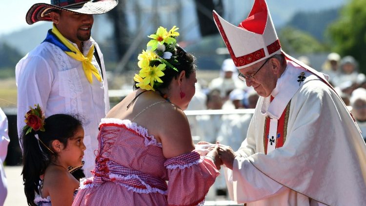 Pope Francis greets an indigenous family at Mass in Temuco, Chile