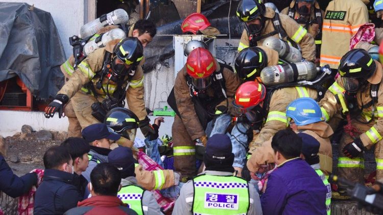 South Korean rescue workers on the scene of a fire in a hospital in Miryang