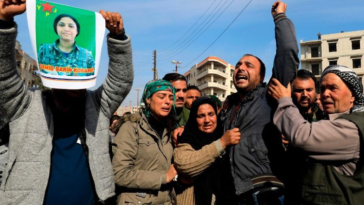 The family of the late 23-year-old YPJ fighter Barin Kobani during a mourning ceremony after Turkish-backed Syrian rebels filmed her mutilated body   
