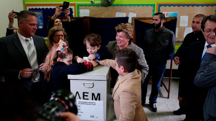 The first lady of Cyprus, Andri Anastasiades, casts her ballot at a polling station in Limassol 