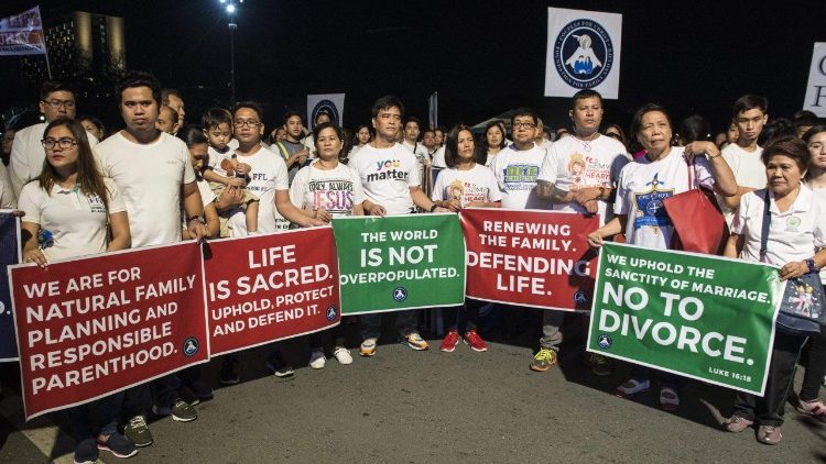 Philippine Catholics carry placards in a "March for Life" in the capital Manila, Feb. 24, 2018. 