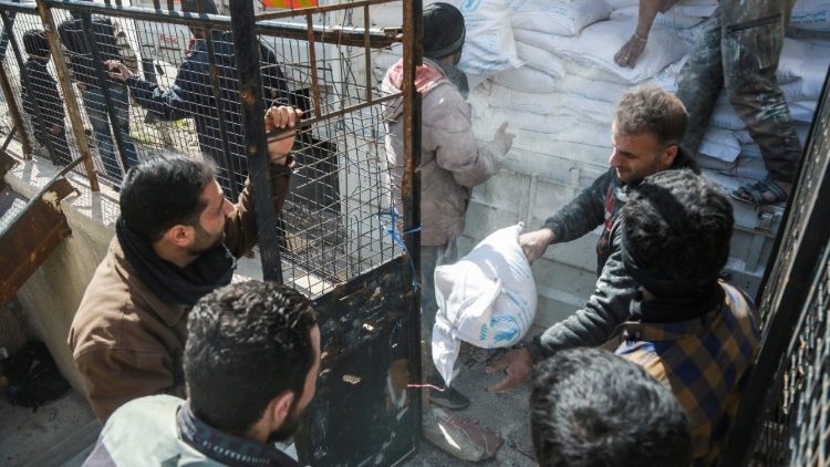 Humanitarian aid being distributed in the Syrian town of Douma in the rebel-held enclave of eastern Ghouta