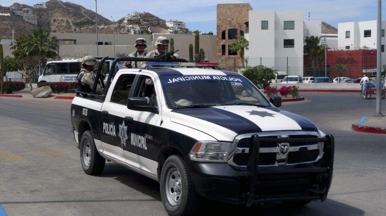 Mexican municipal police officers patrol streets in Los Cabos, Mexico