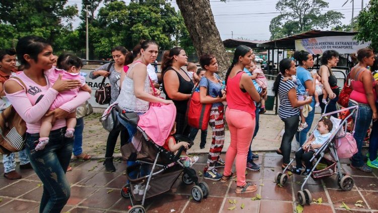 Venezuelans, who have crossed the border into Colombia, queue for vaccinations 