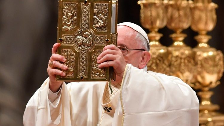 Pope Francis elevates the Book of the Gospels during Mass