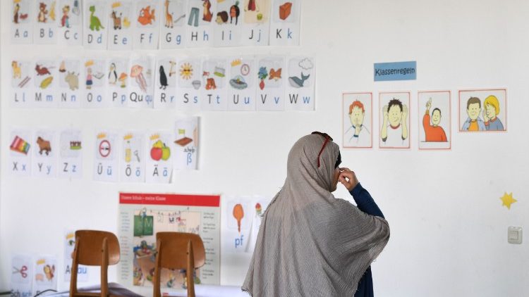A refugee in a school room in a transit center for refugees in Bavaria