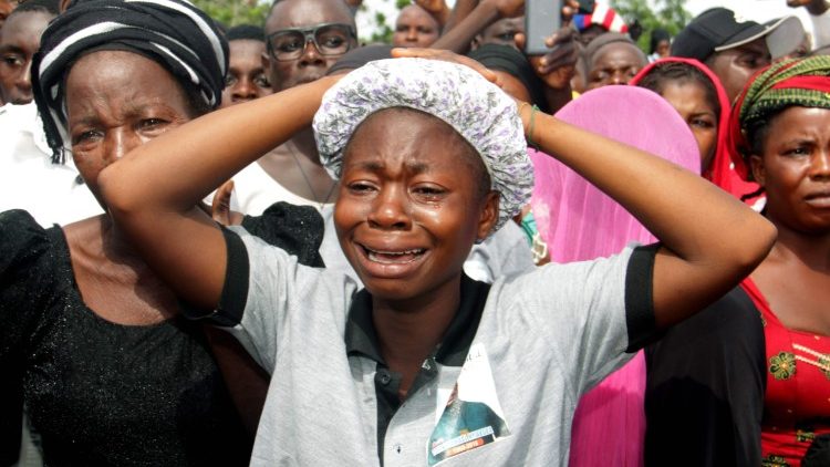 Mourners at a funeral for Christians murdered by Islamic militants in Nigeria  