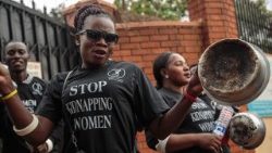 topshot-uganda-crime-social-women-demo-1528213954016.jpg