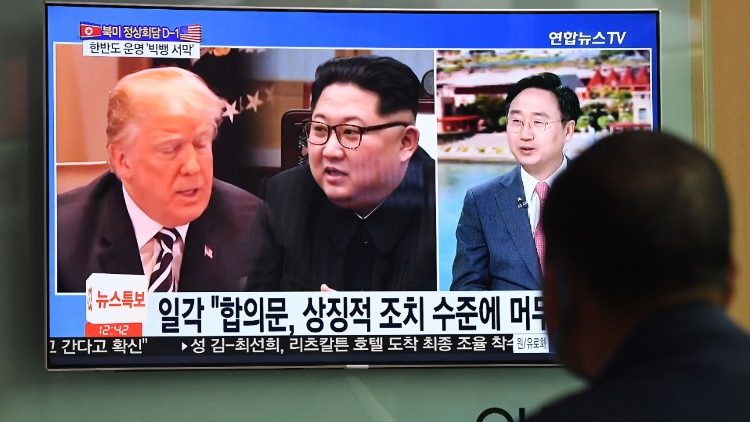 A man follows progress of the North Korea-US summit