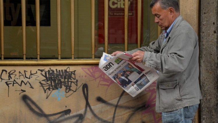a man reads a local newspaper in Bogota after conservative Ivan Duque won Colombia's runoff election