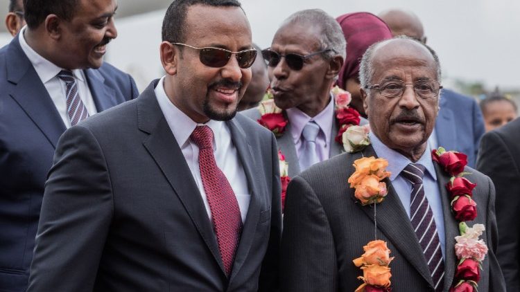 Eritrean Foreign Minister, Osman Saleh Mohammed (R) with Ethiopia's Prime Minister Abiy Ahmed at the ariport in Addis