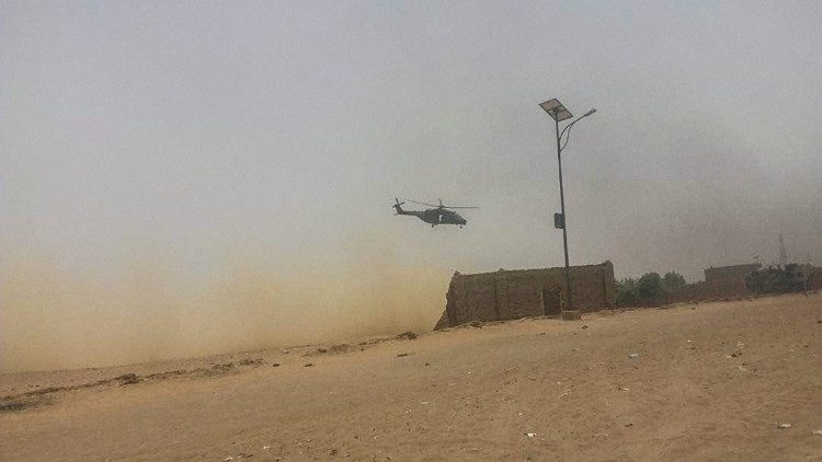 An army helicopter carries out surveillance in Mali