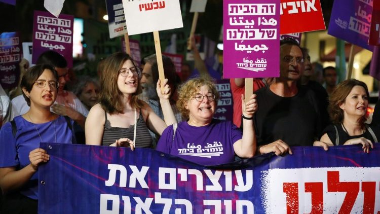Demonstrators attend a rally to protest against "Jewish Nation-State Bill", Tel-Aviv