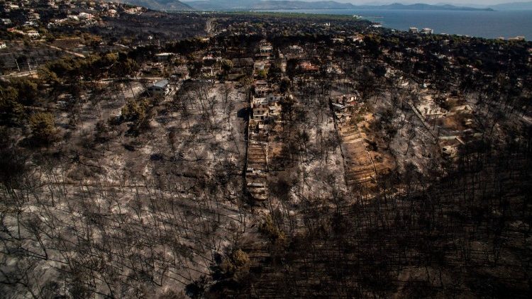An aerial view shows extensive fire damage in the village of Mati near Athens