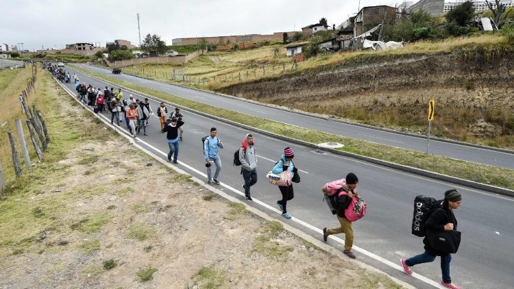 Venezuelan migrants heading to Peru walk along the Panamerican highway