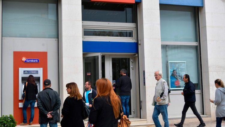 Greeks queue at banks amidst economic crisis