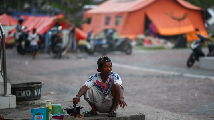 A survivor of Indonesia's earthquake and tsunami at a makeshift camp in Palu.