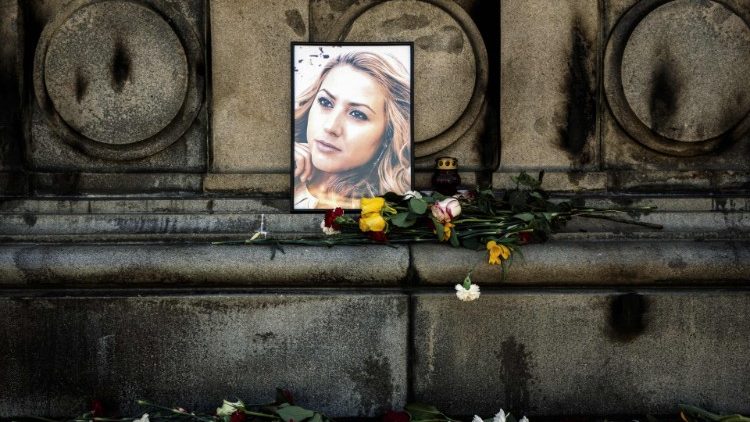 Flowers are placed near a portrait of murdered Bulgarian  journalist Viktoria Marinova, Rousse, October 9
