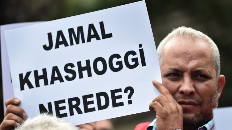 A man holds a placard reading "Where is Jamal Kashoggi?", October 9th 