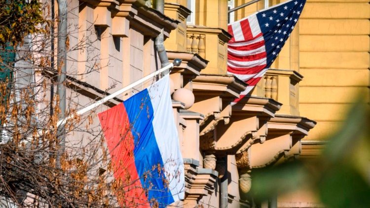 A Russian flag flies next to the US Embassy building in Moscow