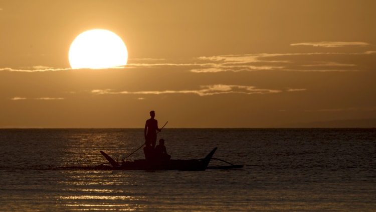 fishing by Boracay island Philippines as the sun sets