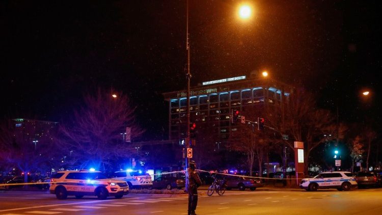Chicago police officers stand outside the Mercy Hospital
