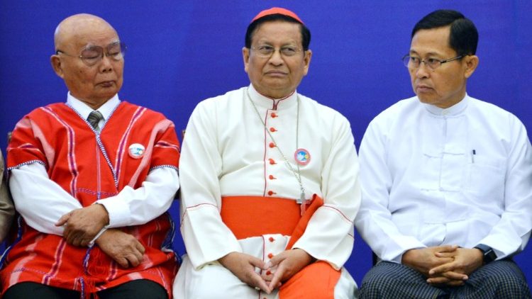 Cardinal Charles Bo flanked by two Myanmar leaders at a peace meeting in November 2018. 
