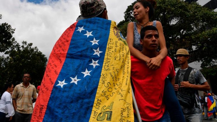 Opposition demonstrators take part in protests against the government of Nicolas Maduro