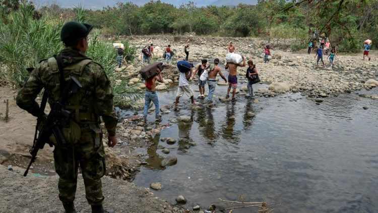 Venezuelans attempt to cross the border into Colombia after opposition efforts to bring in humanitarian aid were halted by the government