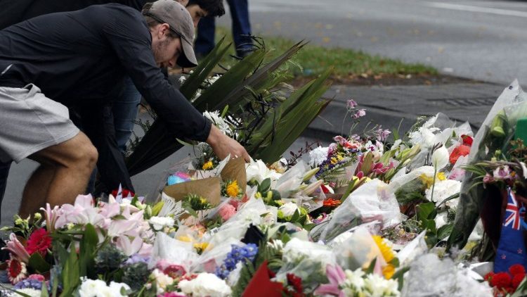People lay flowers following New Zealand attacks