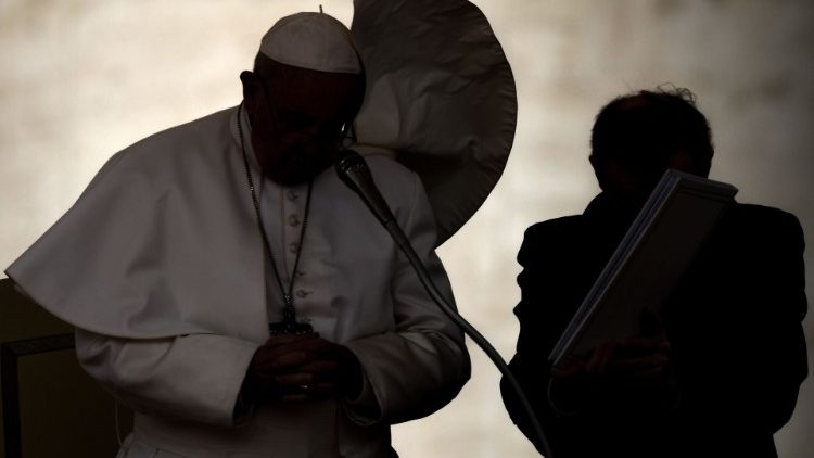 Pope Francis pauses to pray at the weekly General Audience