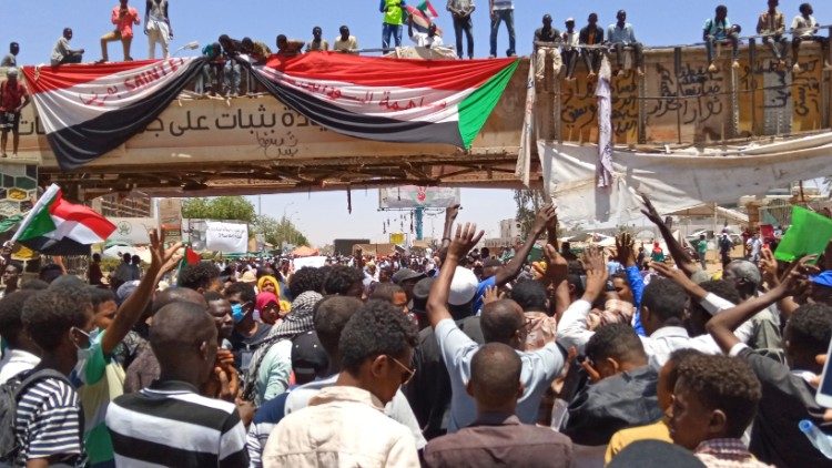 Sudanese demonstrators gather near the military headquarters in Khartoum 
