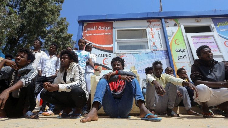 African migrants who fled battle zones in Libia gather at a detention center in Zawiya, west of Tripoli
