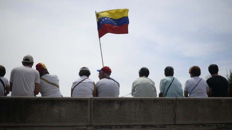Oppositioin demonstrators take part in a May Day rally in Caracas