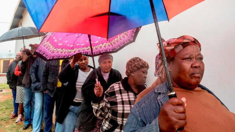 South Africans queue to vote at a polling station in the Tlhabologang township in Coligny, North West province