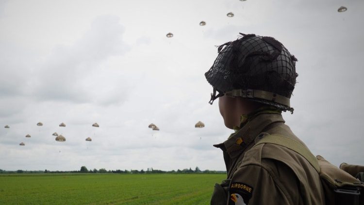 Paratroopers perform a jumb over Sannerville in north-western France prior to D-Day commemorations