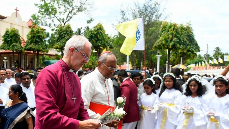 Anglican Archbishop Justin Welby of Canterbury (L) paying tribute to the victims of the Easter Sunday terrorist attack at St. Sebastian's Church in Negombo, Sri Lanka.