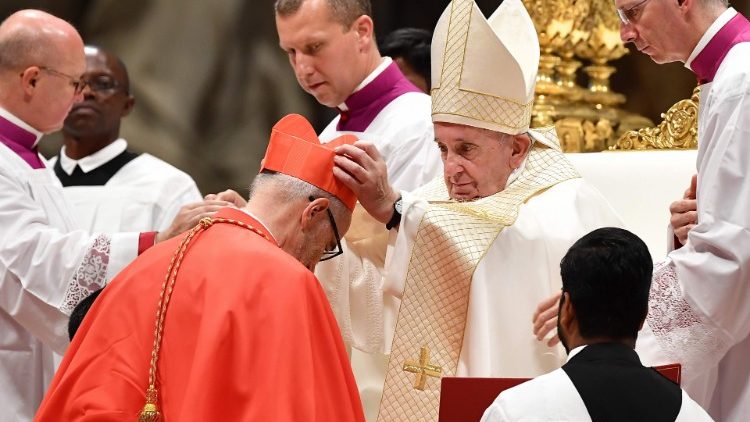 Michael Czerny receives the cardinalatial biretta from Pope Francis