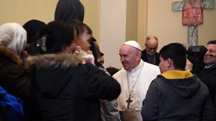 Pope Francis meets a group of migrants in the Vatican