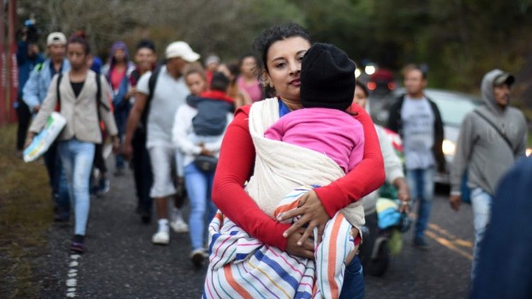 Honduran migrants walk in a caravan to the US 