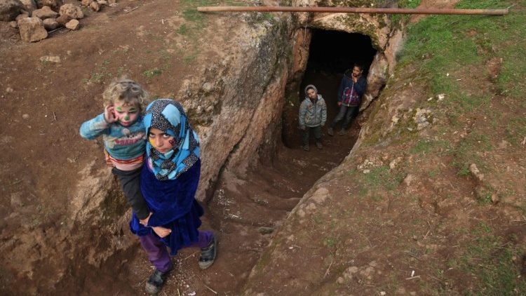 Displaced Syrian children in an underground shelter in Idlib province, Syria. 